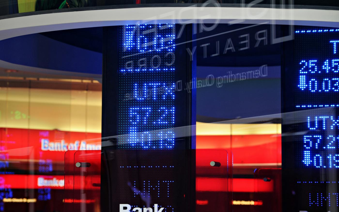 a bank sign in front of a building by Oren Elbaz courtesy of Unsplash.