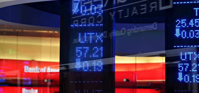 a bank sign in front of a building by Oren Elbaz courtesy of Unsplash.