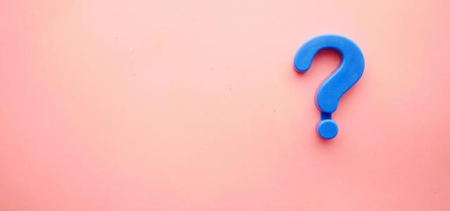 a blue question mark on a pink background by Towfiqu barbhuiya courtesy of Unsplash.